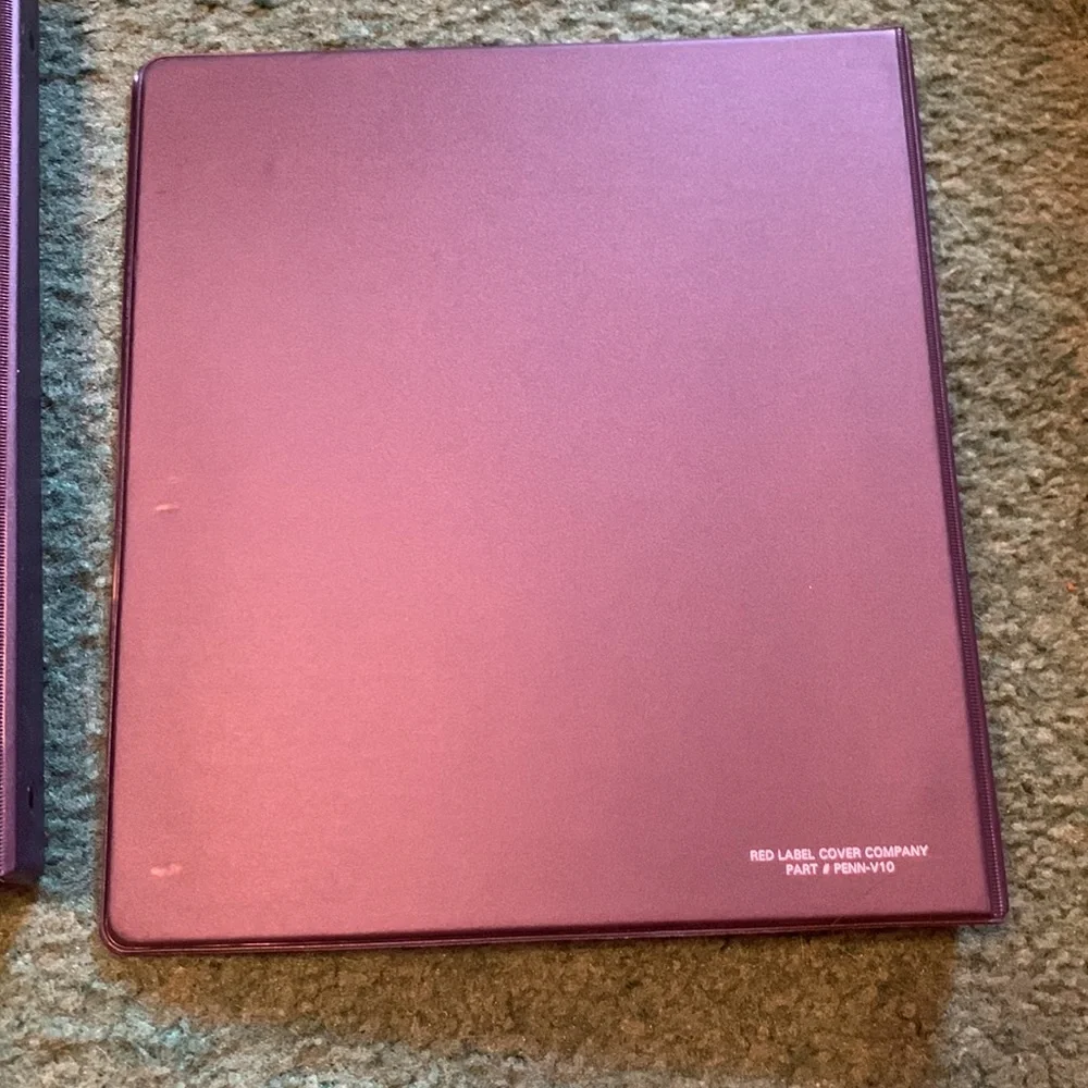 2 Penn state binders. Rough measurements in photos.